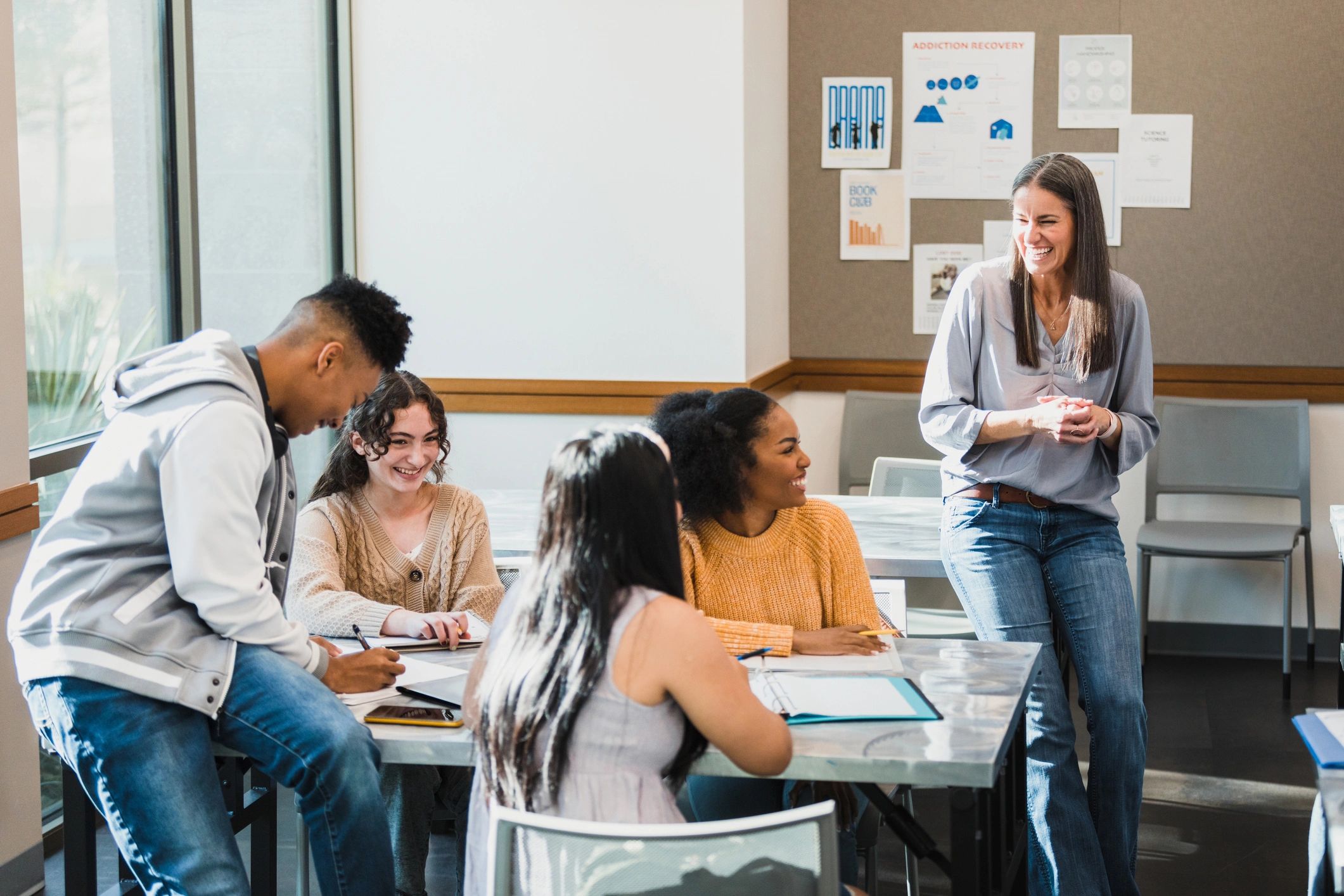 Educator engaging with a diverse group of students