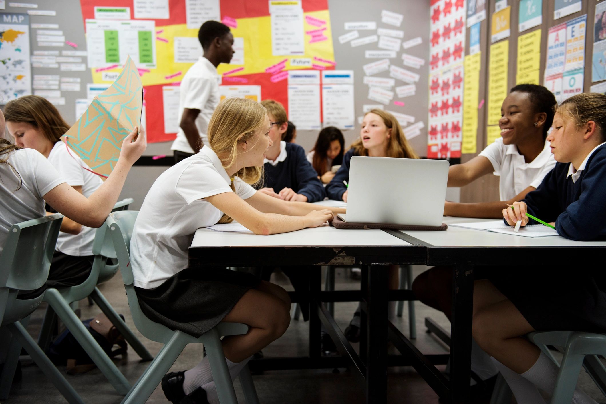 Diverse students learning together in a classroom