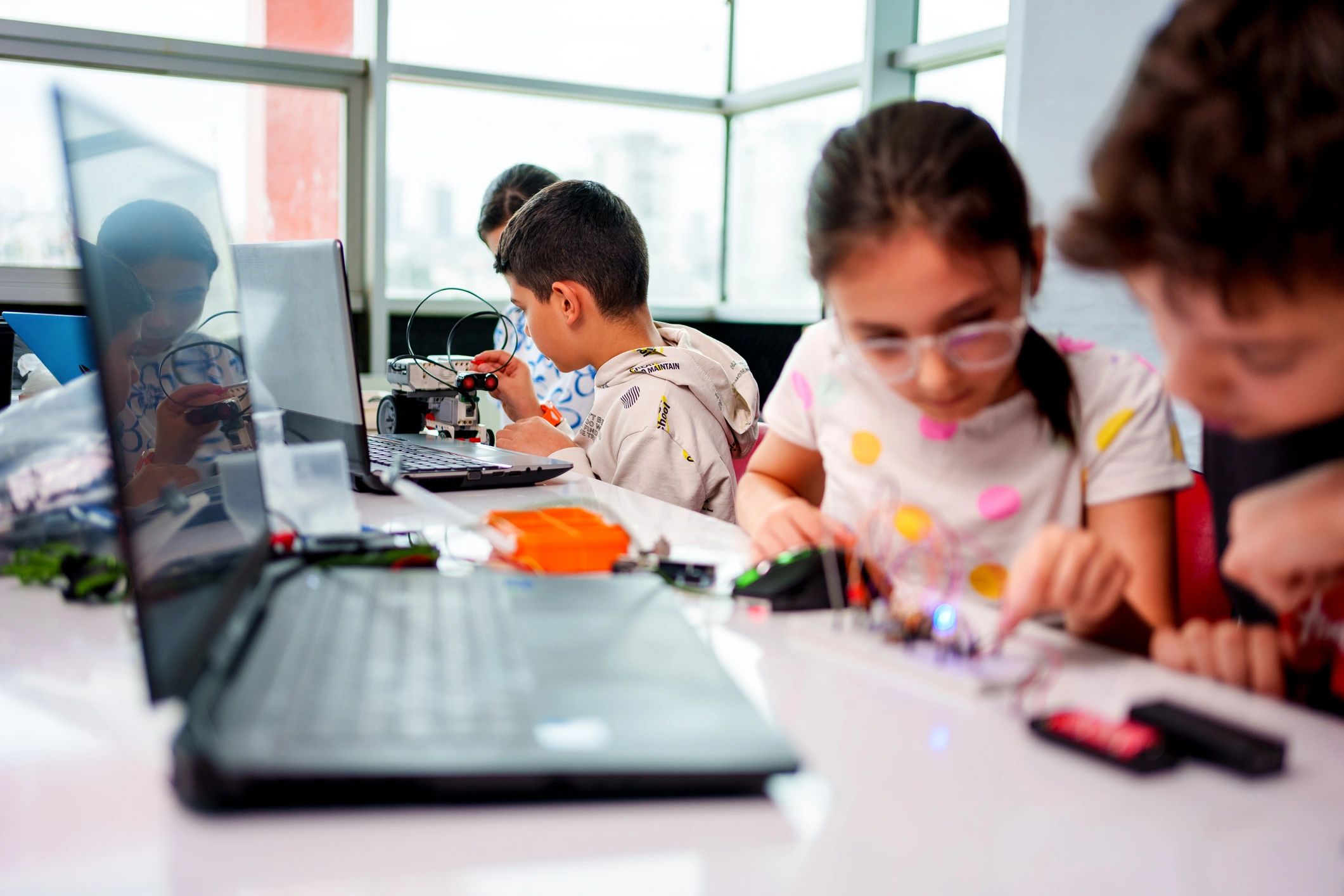 Students collaborating on a hands-on robotics activity