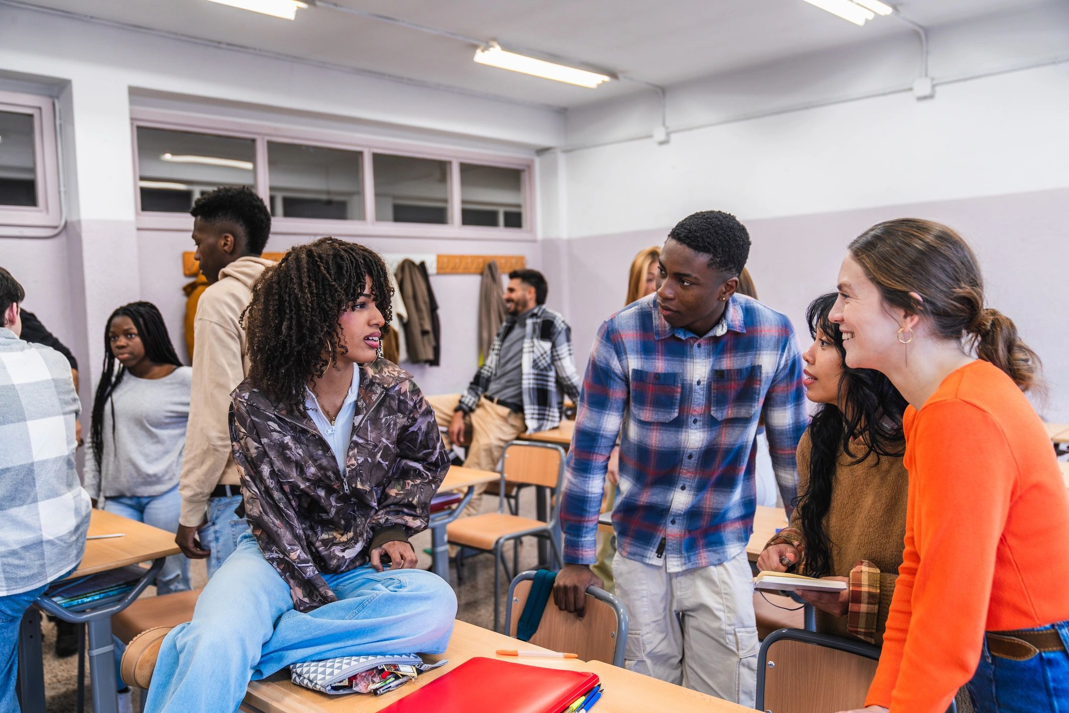 High school students collaborating on a classroom project