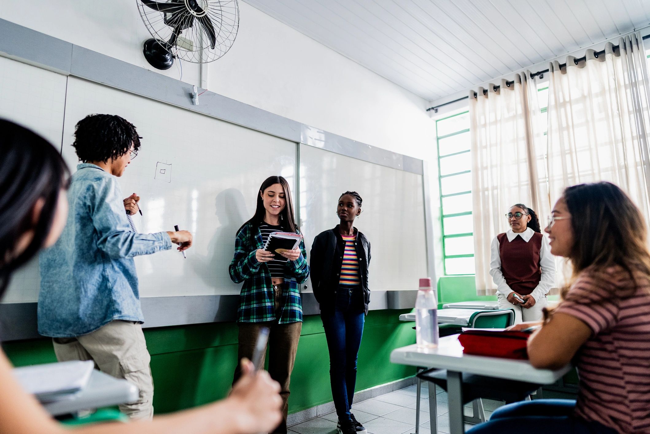 High school students presenting a project in class