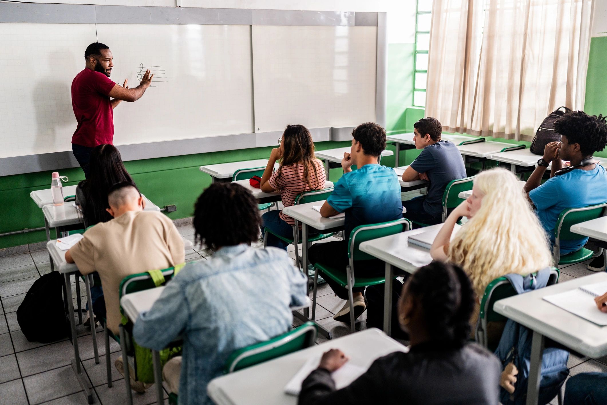 Teacher leading a classroom lesson
