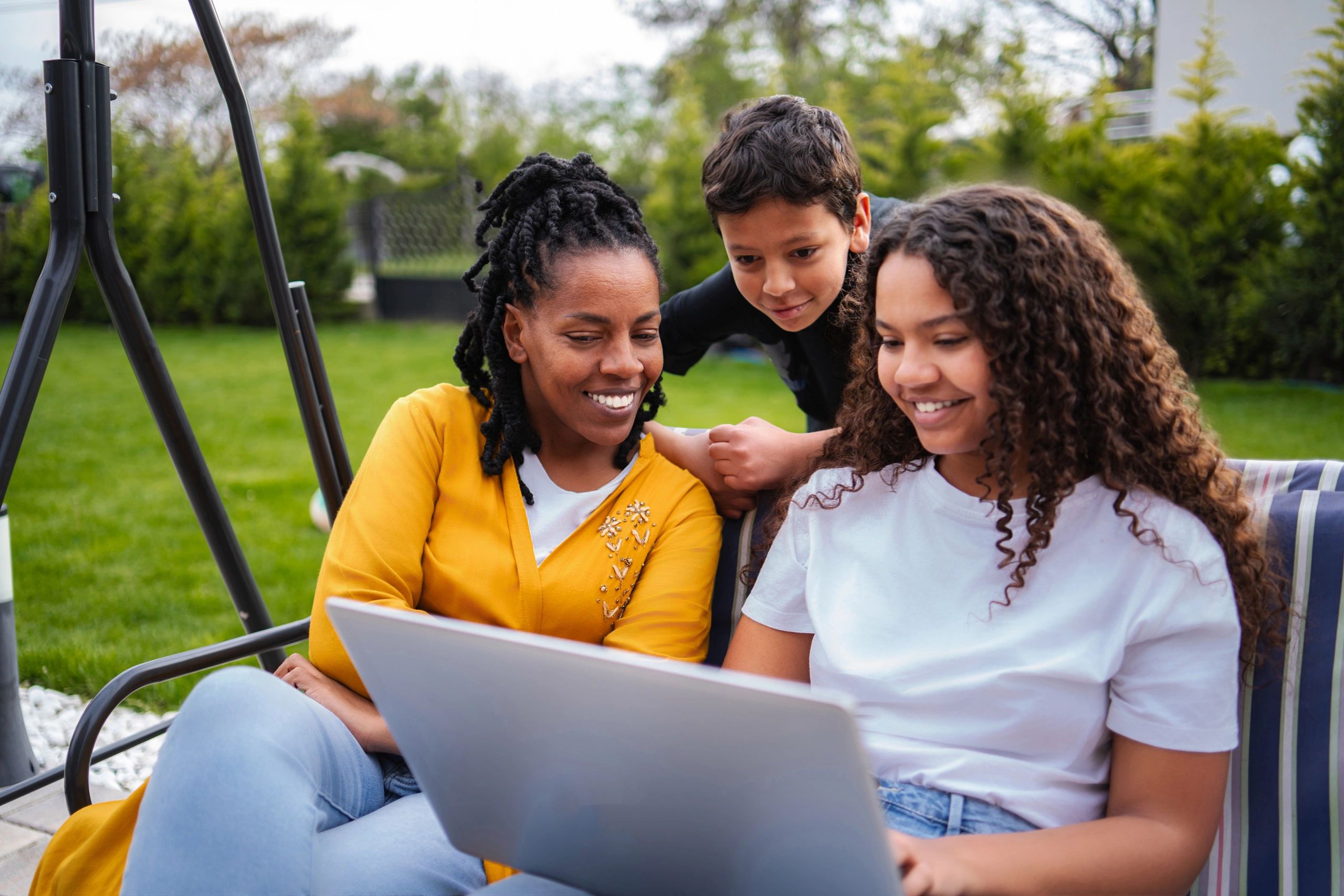 Parent and children connecting together outdoors