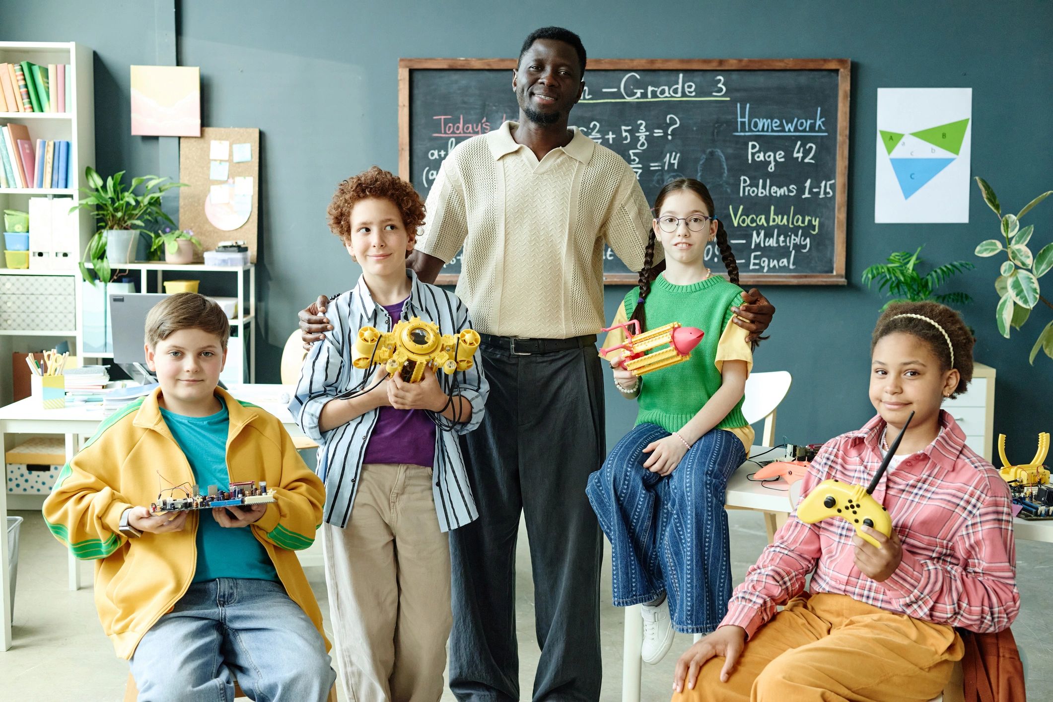 Teacher guiding students in a STEM classroom